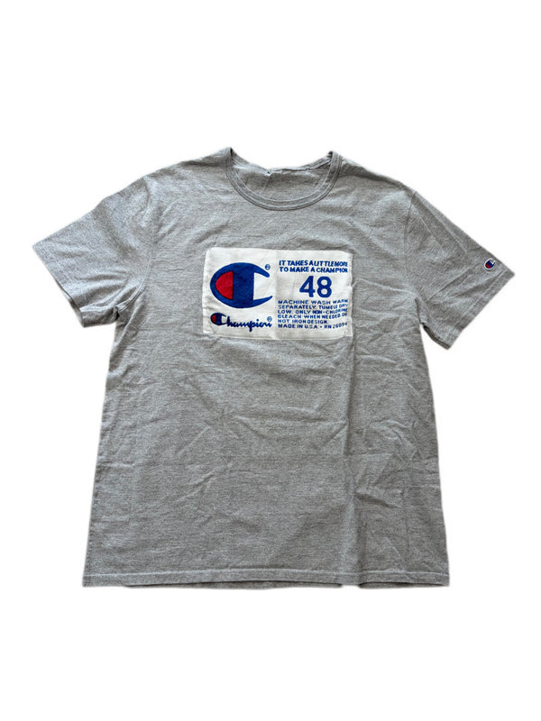 VINTAGE CHAMPION "IT TAKES A LITTLE MORE TO MAKE A CHAMPION" GRAPHIC TEE